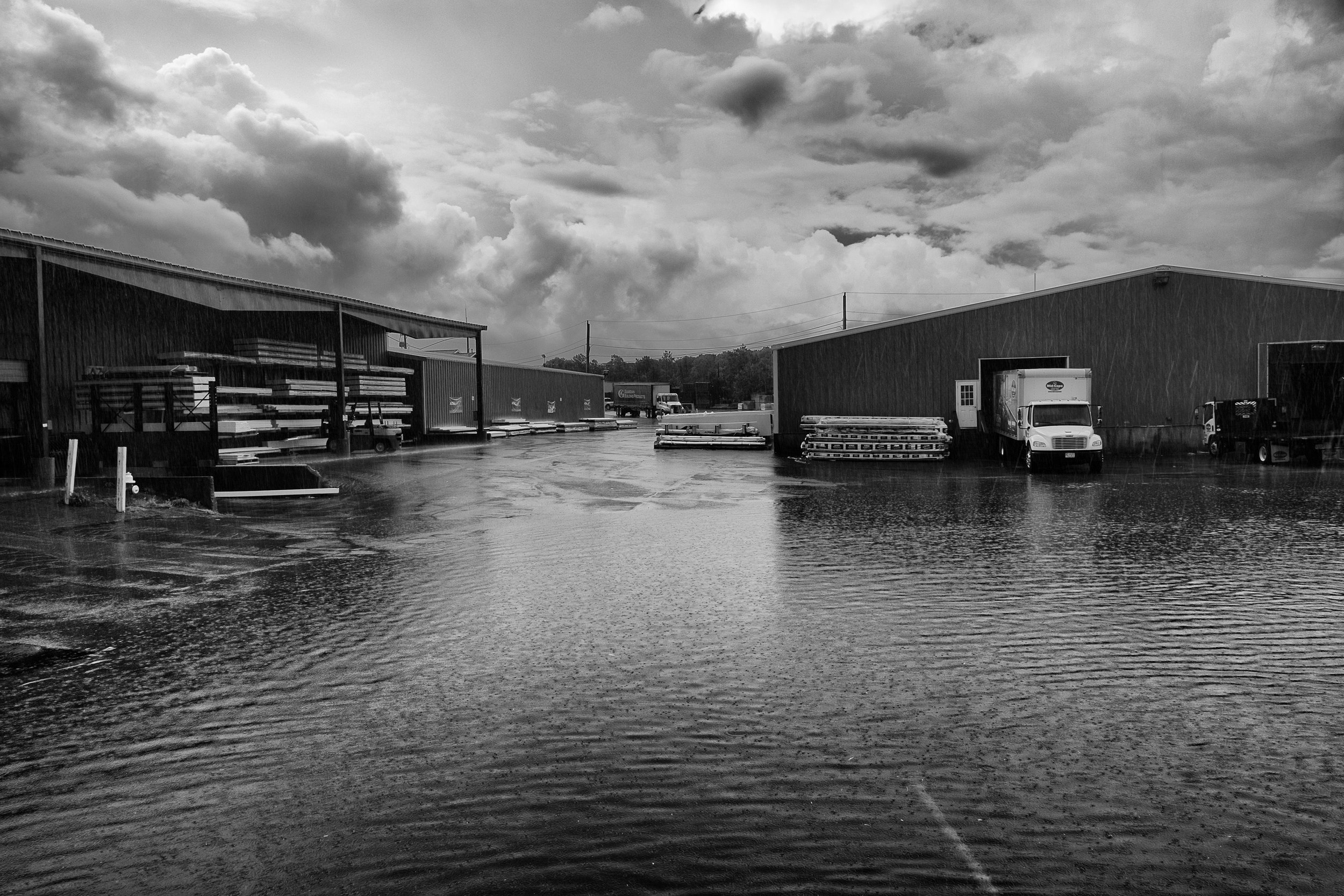 During heavy rains, the parking lot in between Building 9 and Building 4 floods to nearly knee high water at some points. Despite this, the yard keeps humming away.