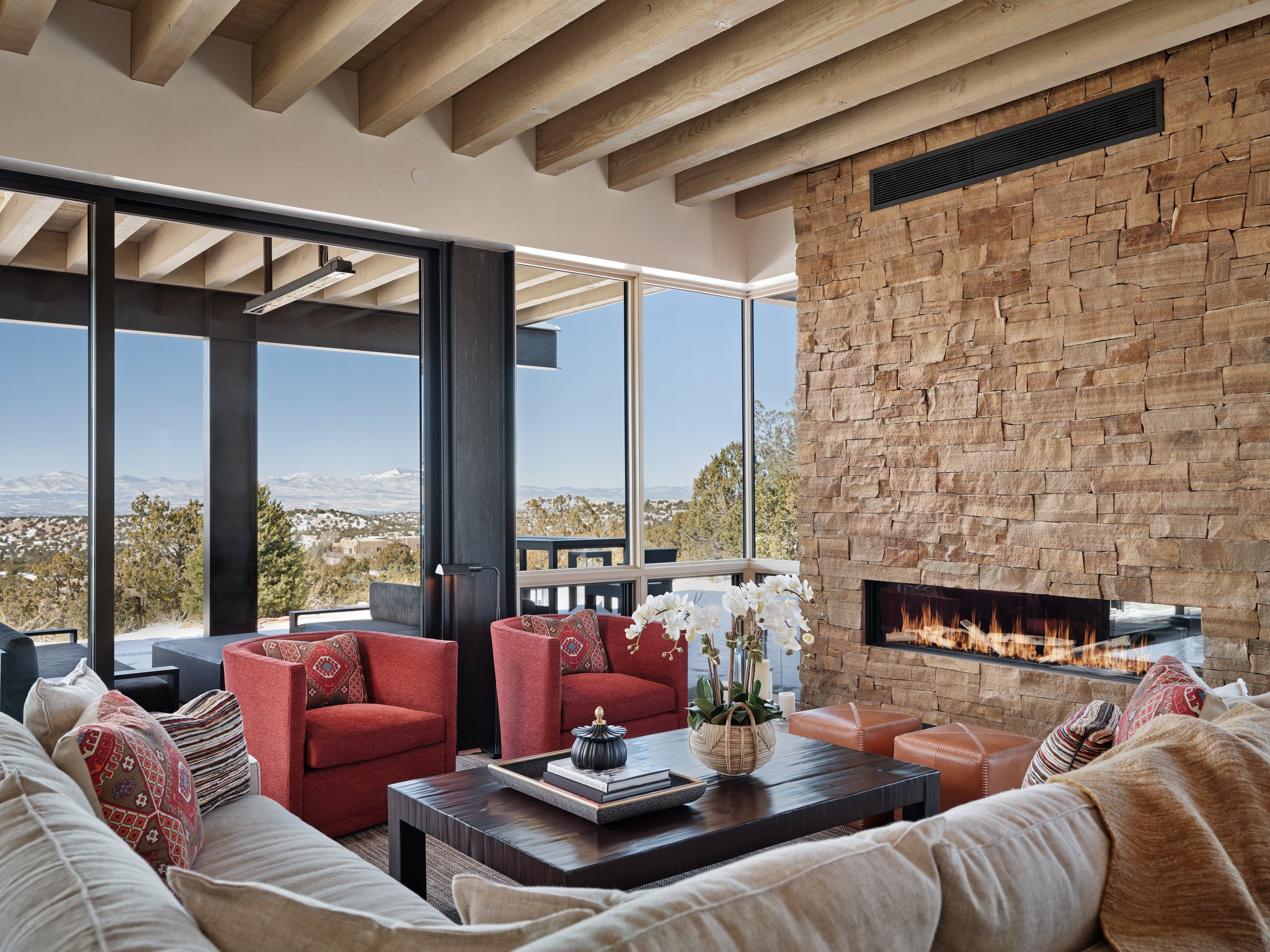 living-room-with-large-glass-windows-with-a-view-of-santa-fe-mountains.jpg