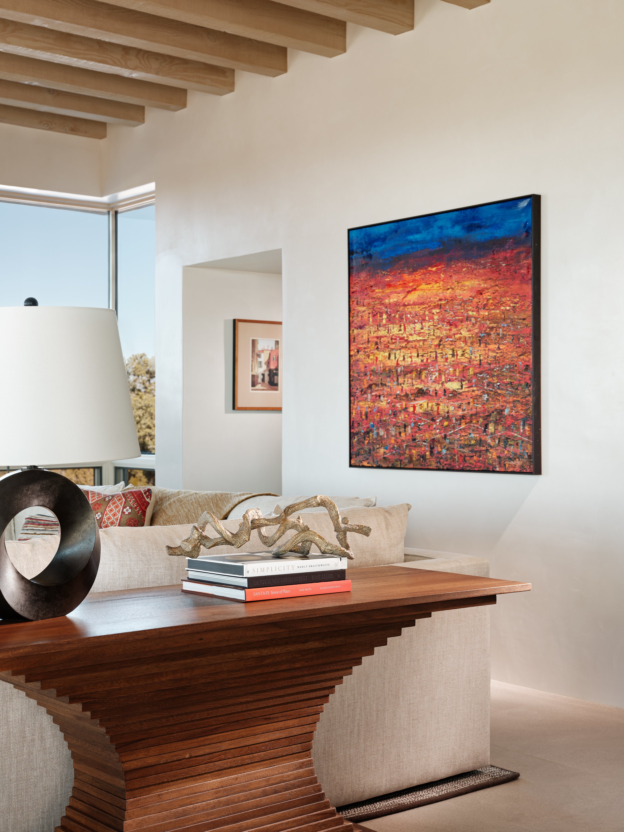 living-room-with-a-large-painting-and-santa-fe-style-art-pieces.jpg