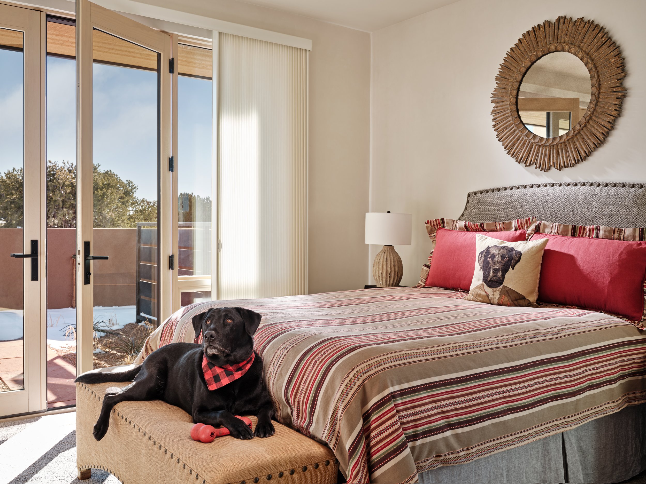 bedroom-with-outside-access-to-a-patio-overlooking-santa-fe-mountains.jpg