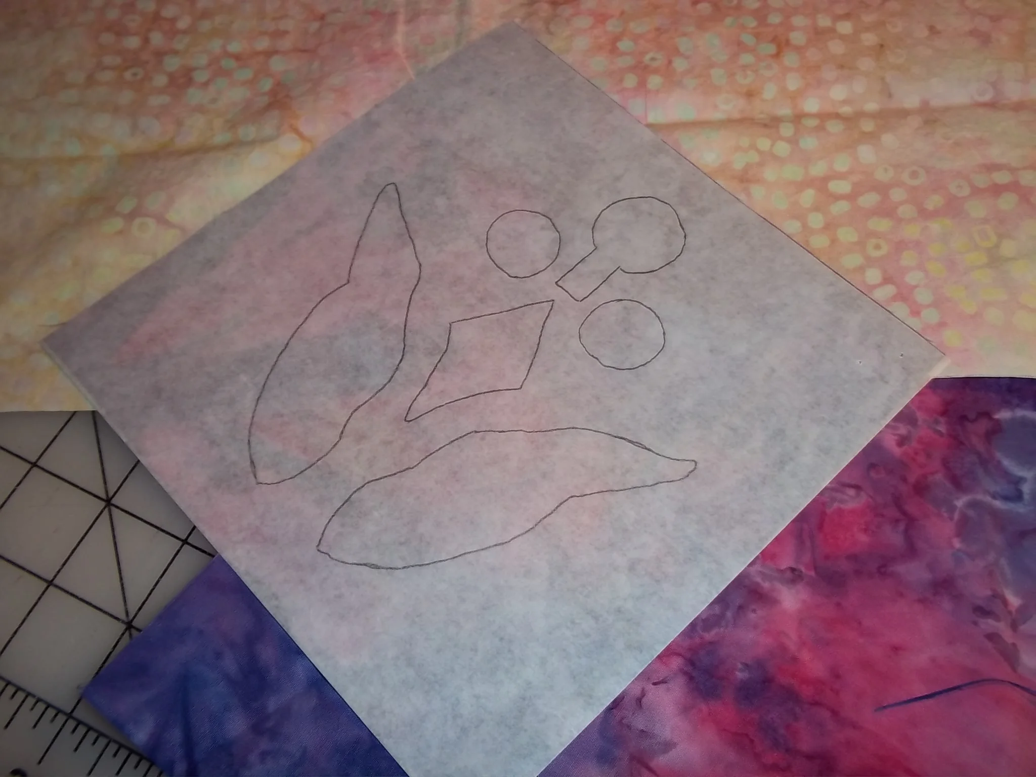 Iron onto wrong side of top fabric.