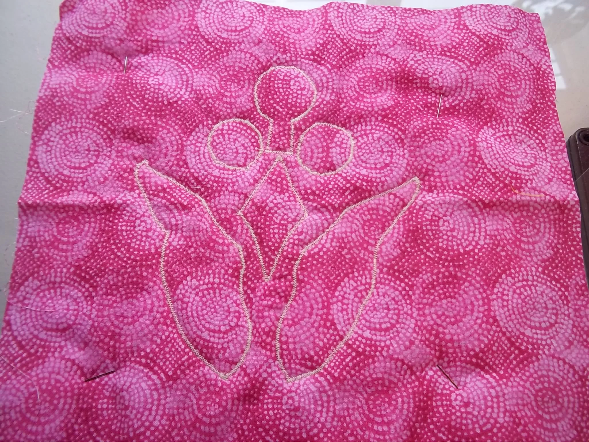 Machine appli-quilted from the back