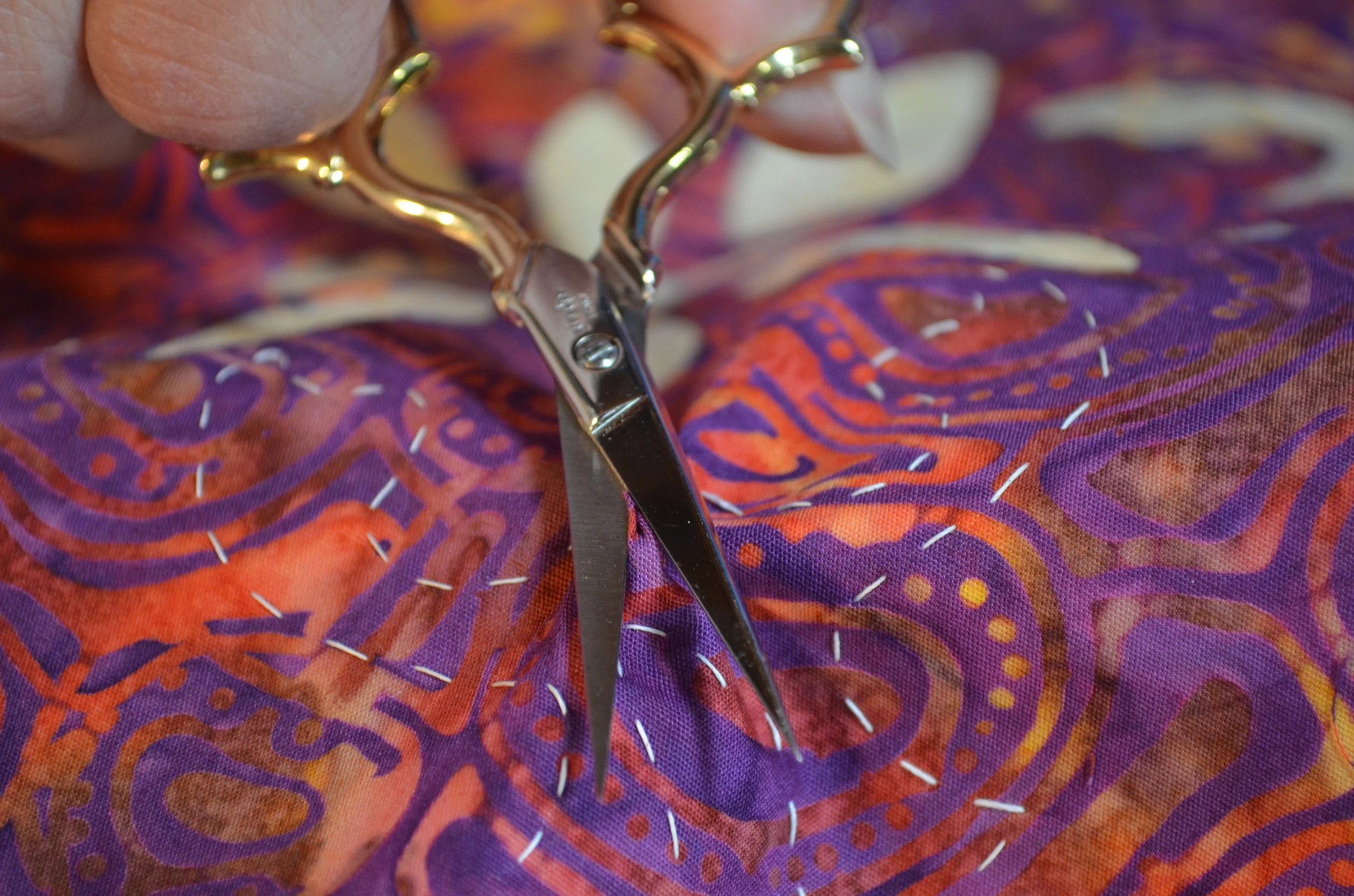 3. Snip in the "hill". Scissors are parallel to the piece. Only making a snip large enough to get my scissors between the layers.