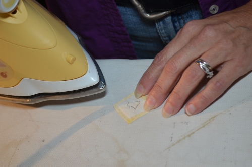 6. Iron fusible onto right side of background fabric.