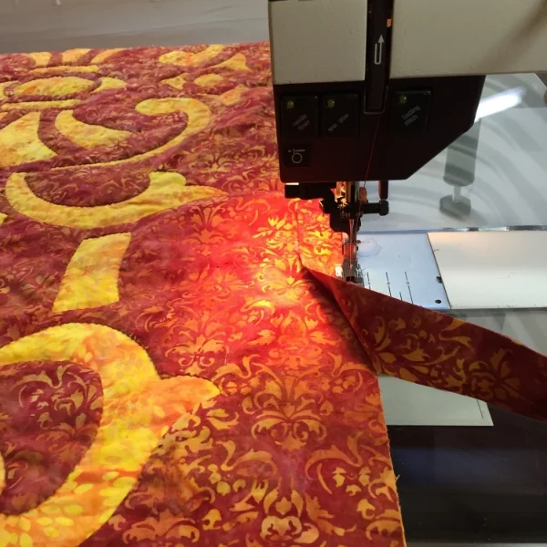 Hand version. Step one of sewing on its binding.