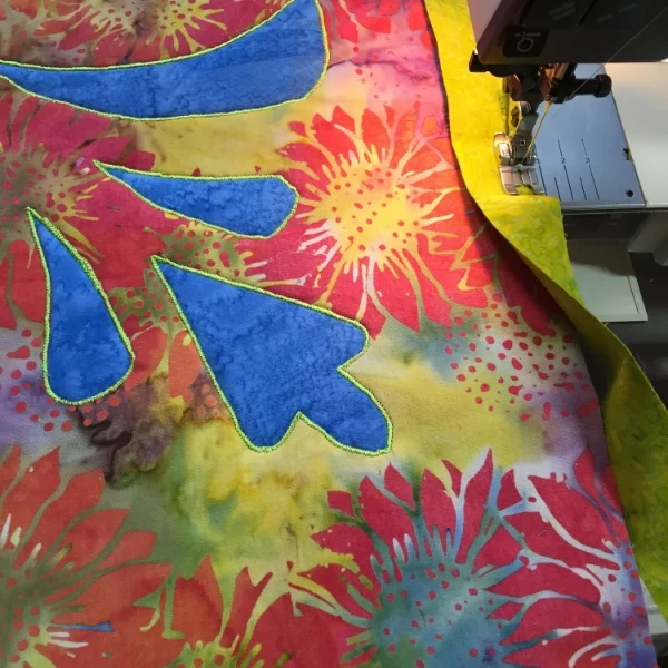 1st frame, green, gets stitched on.