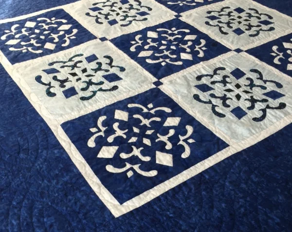 Double Dutch Delft(56" x 56"). 9-12" blocks: 5 Reverse Applique, 4 Applique.