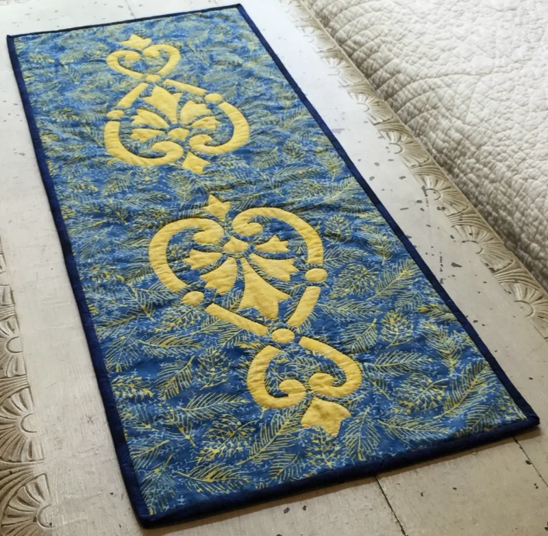 Heart & Fleurs table runner (13.5" x 36") for hand and machine. NEW fabrics from Island Batik.Ask us how to get this design as a FREE Shop Sample. 