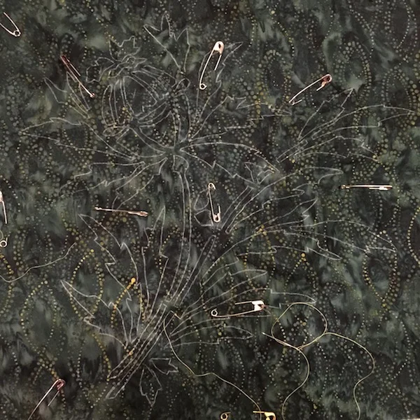 2. Trace pattern on wrong side of background fabric.