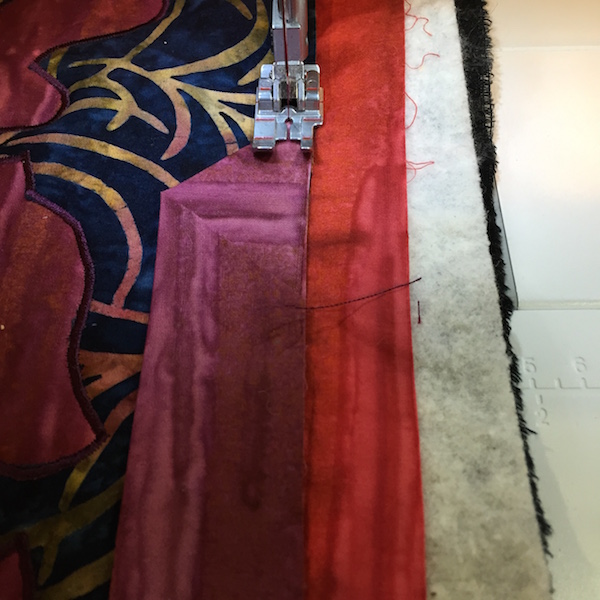Sewing binding on: Finish along raw edge of top.