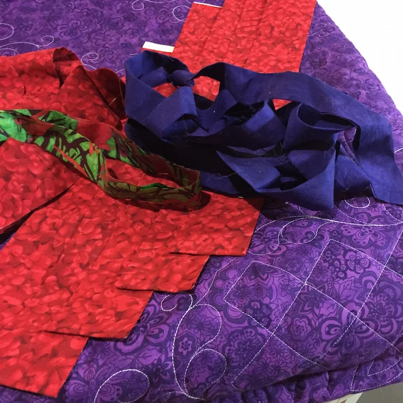 A pile of binding strips for various projects.
