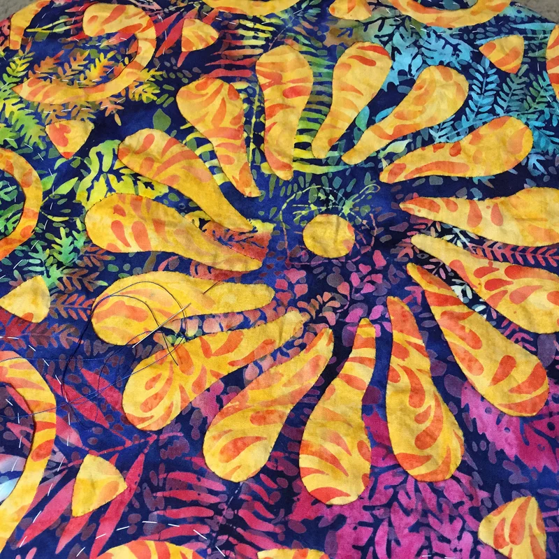 pic 4. Stitch under the raw edges at the basting line to let the design emerge.