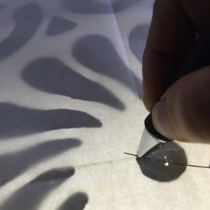 Tracing the pattern onto iron-on fusible.