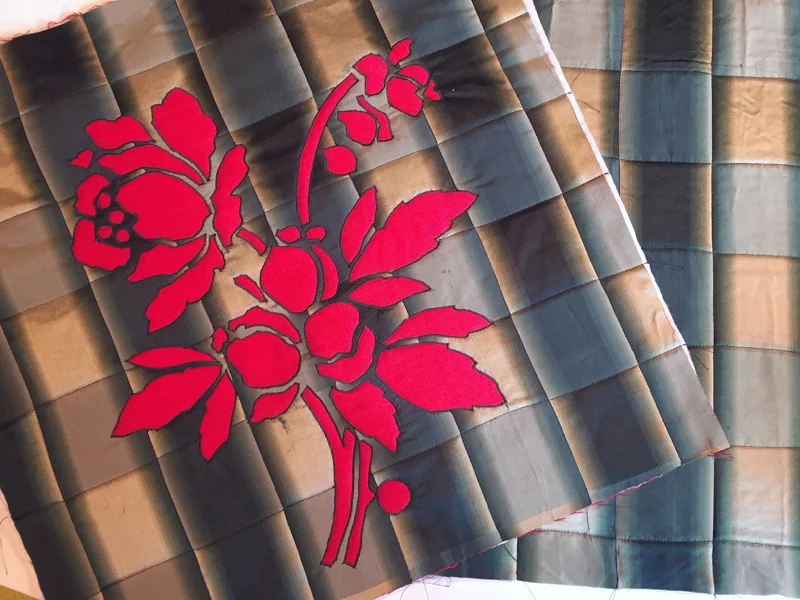 Pillow top and back quilted along plaid lines.