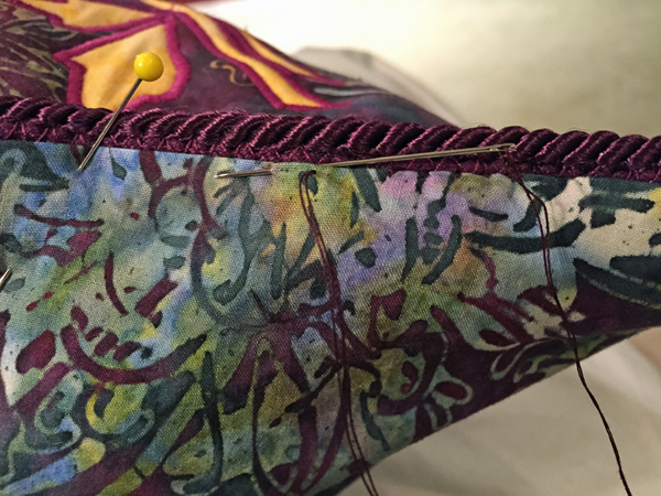 Pic 14a. Whip stitching opening closed with double threaded needle.