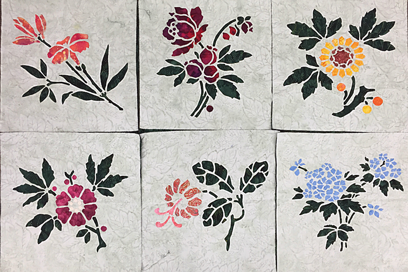 Lily, Rose, Sunflower, Apple Blossom, Trumpet Vine and Forget-Me-Not (16" x 16"). Reverse applique stems and leaves with Applique blossoms.