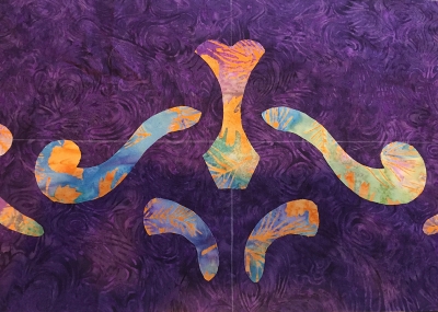 Mark border fabric with centers of height and width to aide in placement of the cut-outs,