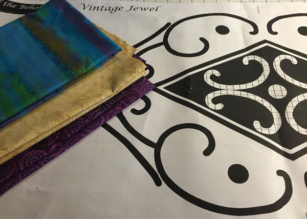 Island Batik fabrics and Vintage Jewel pattern piece. Notice the black and crosshatched shapes in the design.