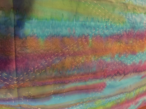 Basting step, seen from the front: reverse applique sections basted. Applique shapes un-basted, so not visible.