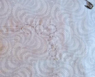 pic.5 Basted on the design lines through all layers of fabric. viewed from the back.