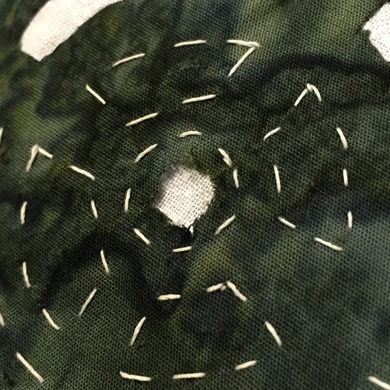 Excess fabric trimmed away to create a seam allowance.