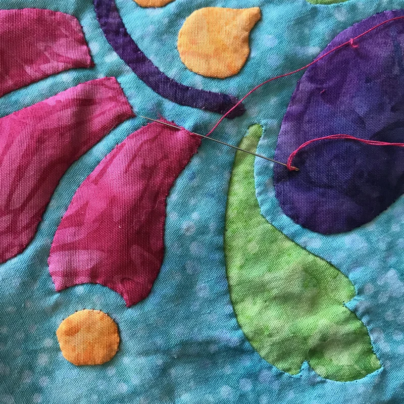 Stitching closed the last side.