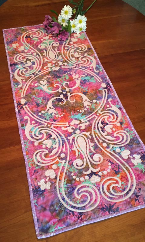Eternal Spring table runner VII (18" x 43") for hand reverse appplique. Designed in fabrics by RJR for Keepsake Quilting.