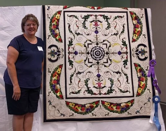 Sharon Engel with her one of her prize winning quilts.