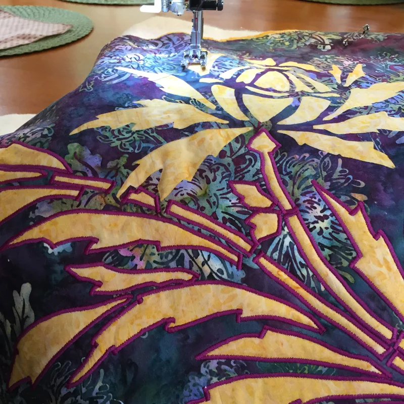 Thistle, 7 of 9 (16" x 16") in process of being machine reverse appliqued. Lots of acute inside points and corners to practice.