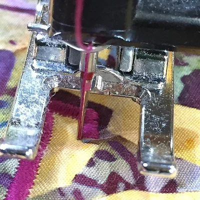 2. raise presser foot in preparation for pivoting.