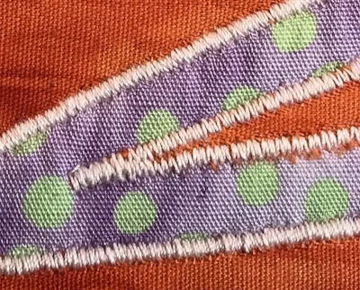 6. Acute outside point done. Stitches of second leg overlap stitches of first leg without any "x-ed" tails at the point.