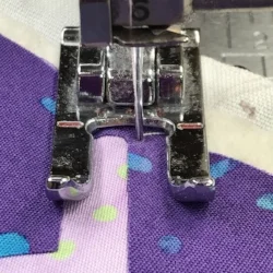 Right hand needle position of the satin stitch is in my top fabric. Top fabric is on my right as I sew.