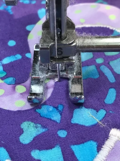 3. After stitching another 3 +/- stitches end with needle in the right hand position of the satin stitch.