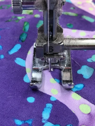 3. Time to pivot again. Remember to leave the needle down in the left hand position of the satin stitch on all outside curves.