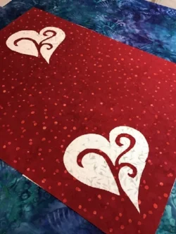 Place mat top from the front with white background fabric peeking through.