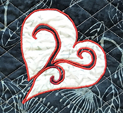 I used red Floriani embroidery thread for my machine reverse applique.