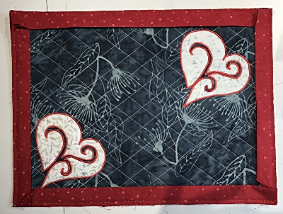 I used red binding for the charcoal gray place mats.