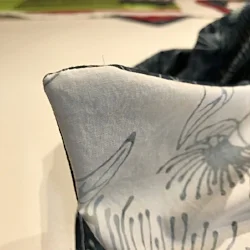 Turn right sides out and crisp up napkin corners with a bodkin or stylus.