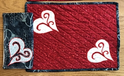 Red place mat with napkin ready for your table.