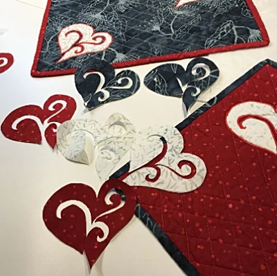Cut them out carefully so you have the fused hearts to use for applique. Quite a pile of potential creative fun.