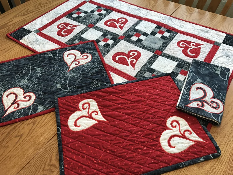 Make this cute Valentine's table decor set by machine reverse applique. Find out how in the blog "Feel the Love with Snowy Hearts".