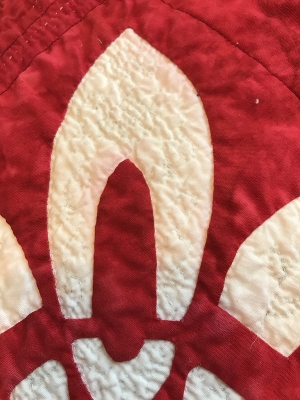 Block 1. The white has turned pink in spots from bleeding red dye.