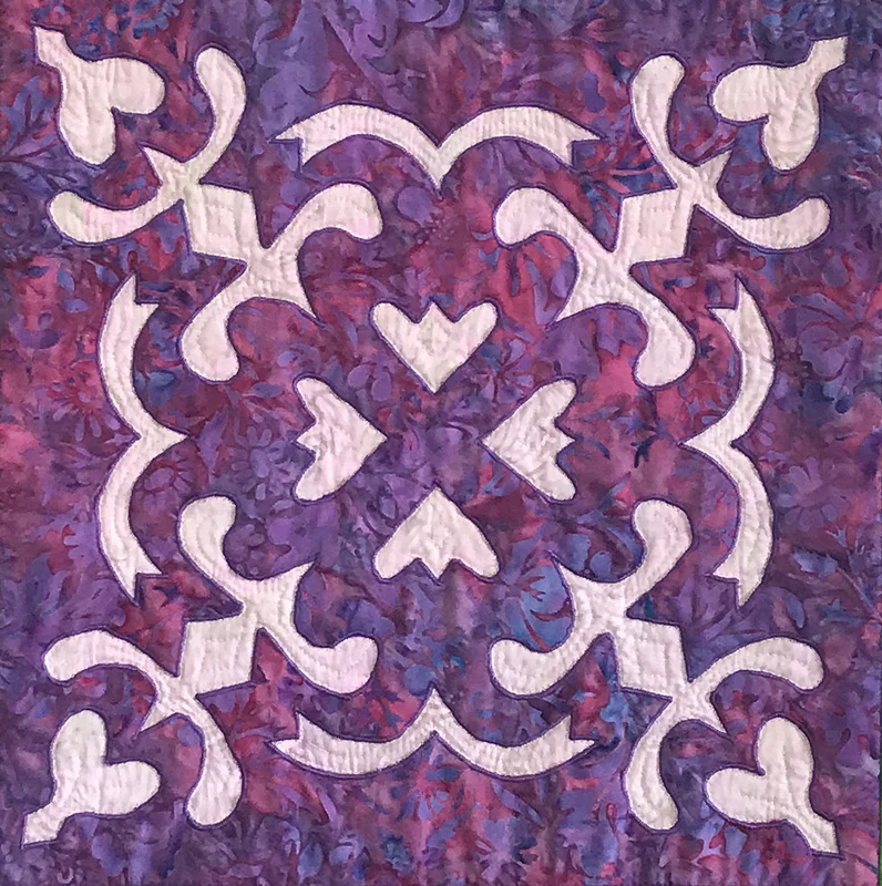 Spring Love block (12" x 12") created by hand reverse applique using Trace, Baste, Snip & Stitch.