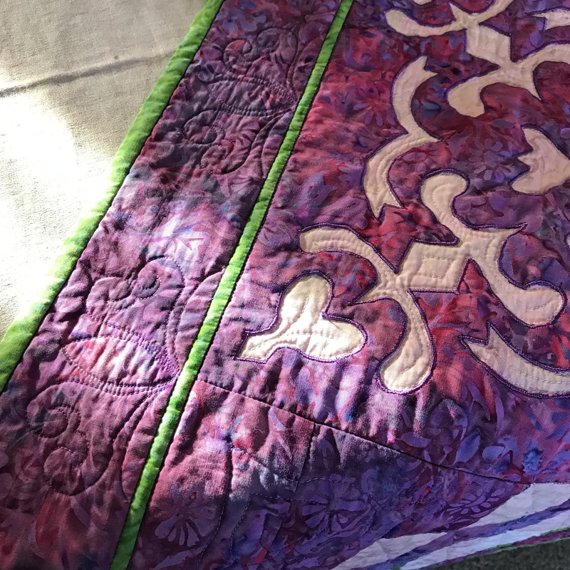All quilted. Notice also that in the center Spring Love block I quilted in the negative space of the reverse applique to accent the stitching.