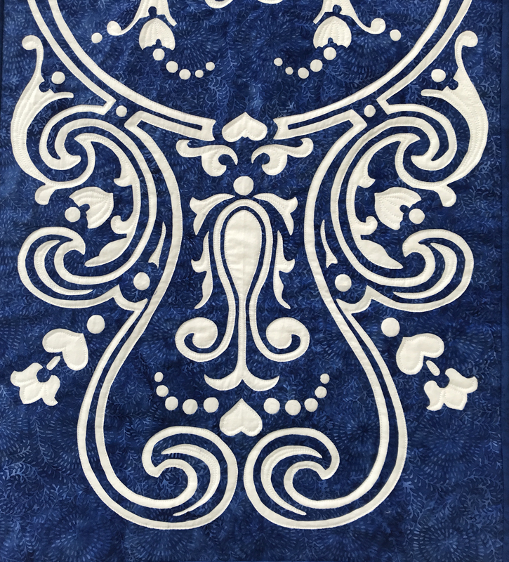 Eternal Spring, table runner VII (18" x 43"). hand reverse applique. Designed for RJR Fabrics.