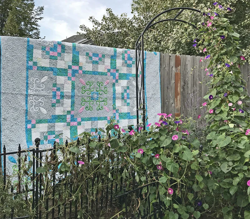 Spring Breeze (98” x 98”). hand or machine reverse applique with applique. Designed for Batik Textiles fall 2017.