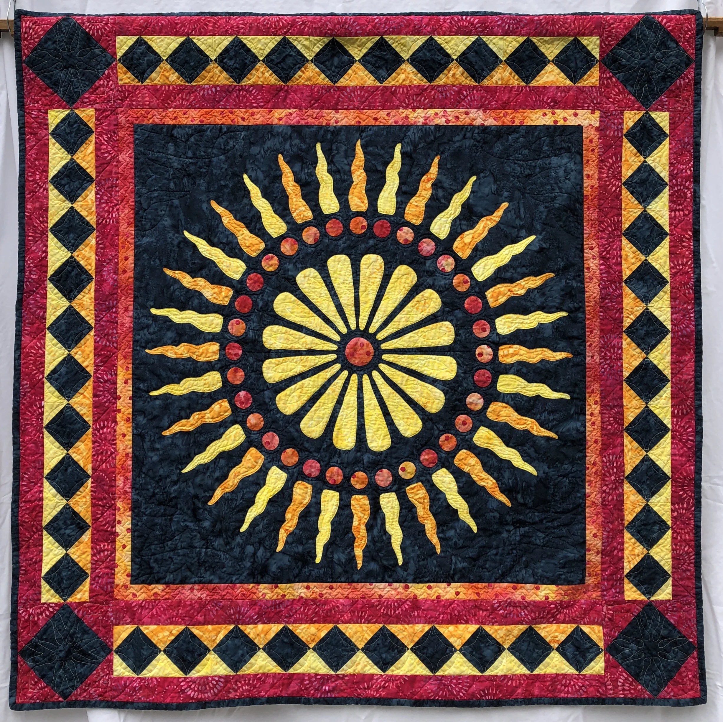 Glorious, Medallion XV (42” x 42”) for hand or machine reverse applique with under-coloring, over-coloring and paper-piecing.