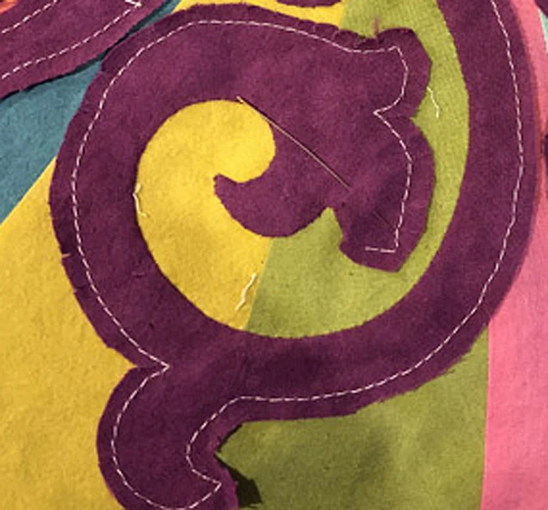 Machine basted Whirlwind Medallion VI . Reverse needle turn applique in process.