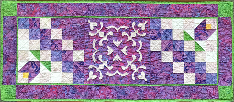 Flowers in the Wind table runner . Kits are also available for this pattern.
