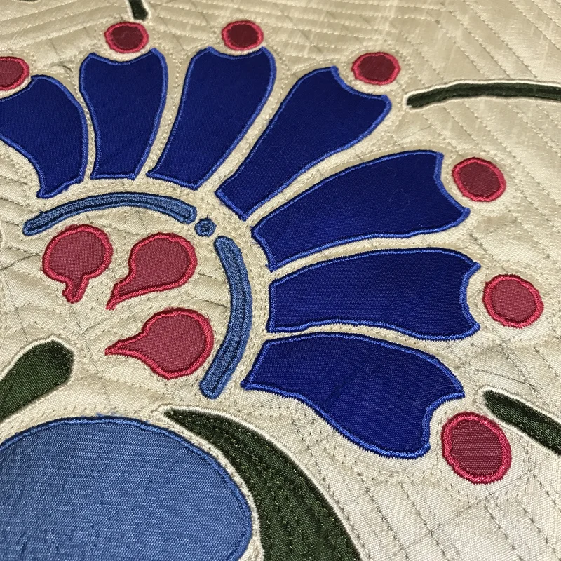 Amidala’s Flower blossom- petals machine applique, leaves machine reverse applique.